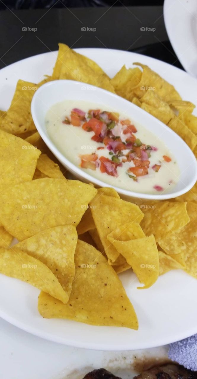 Chips Dip with Queso as Queso Swims with Pico