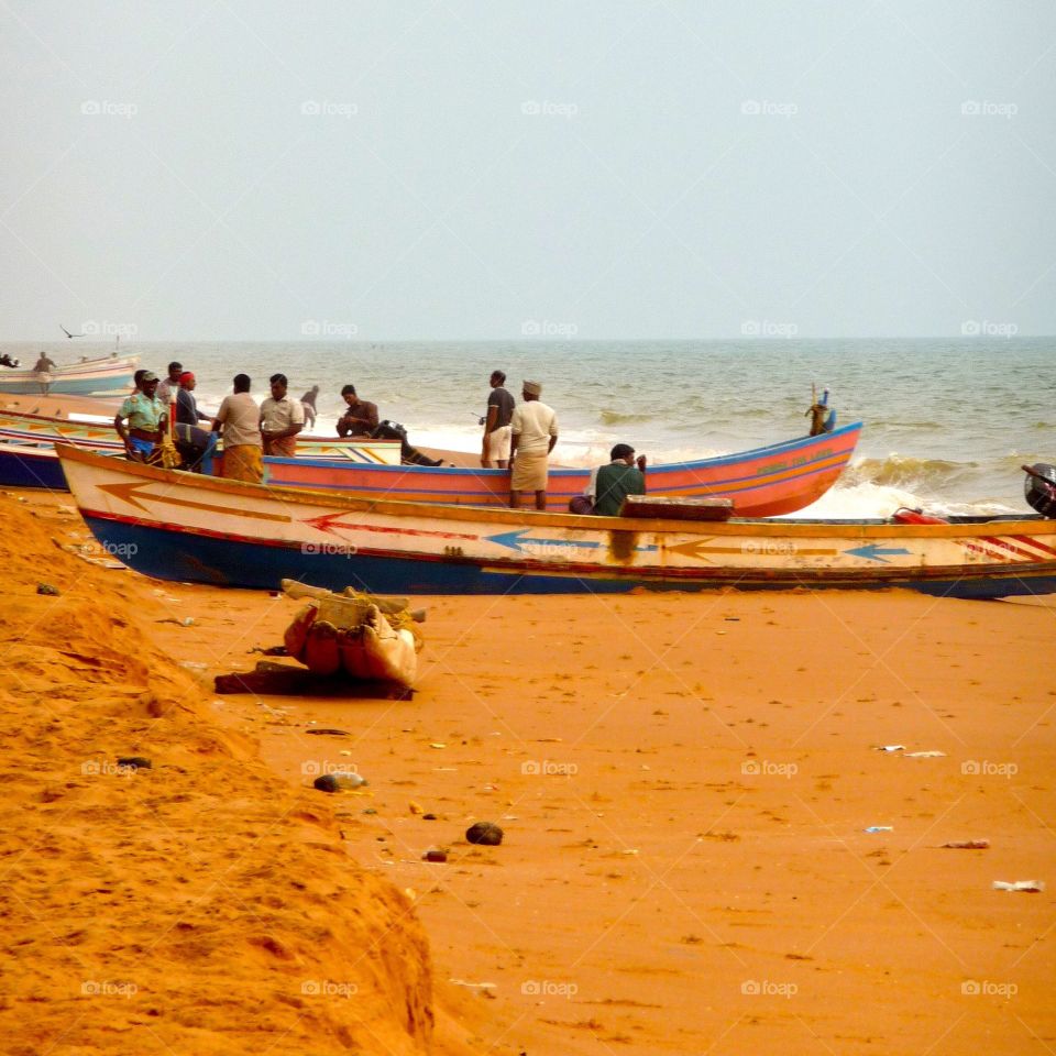 Fishermen at beach close to Trivandrum, Kerala
