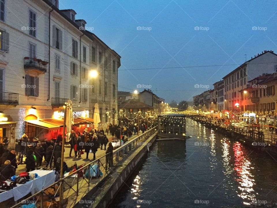 Lights at night in the streets beside the canal place called Navigli. A romantic place in Milan