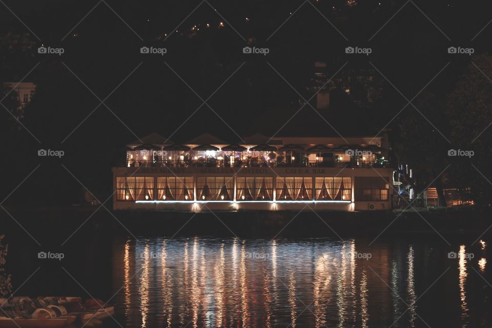 view of a night restaurant by the river
