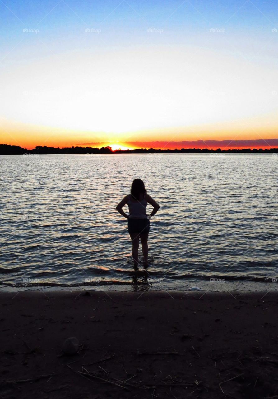 A friend and I went camping at a lake in Minnesota, and while she wasn't looking, I got this shot of her. 