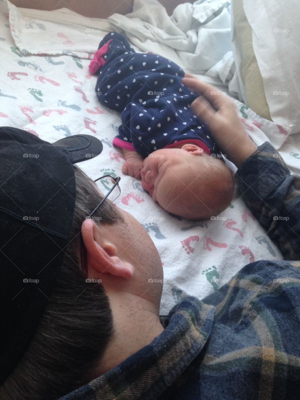 Father admiring his newborn child