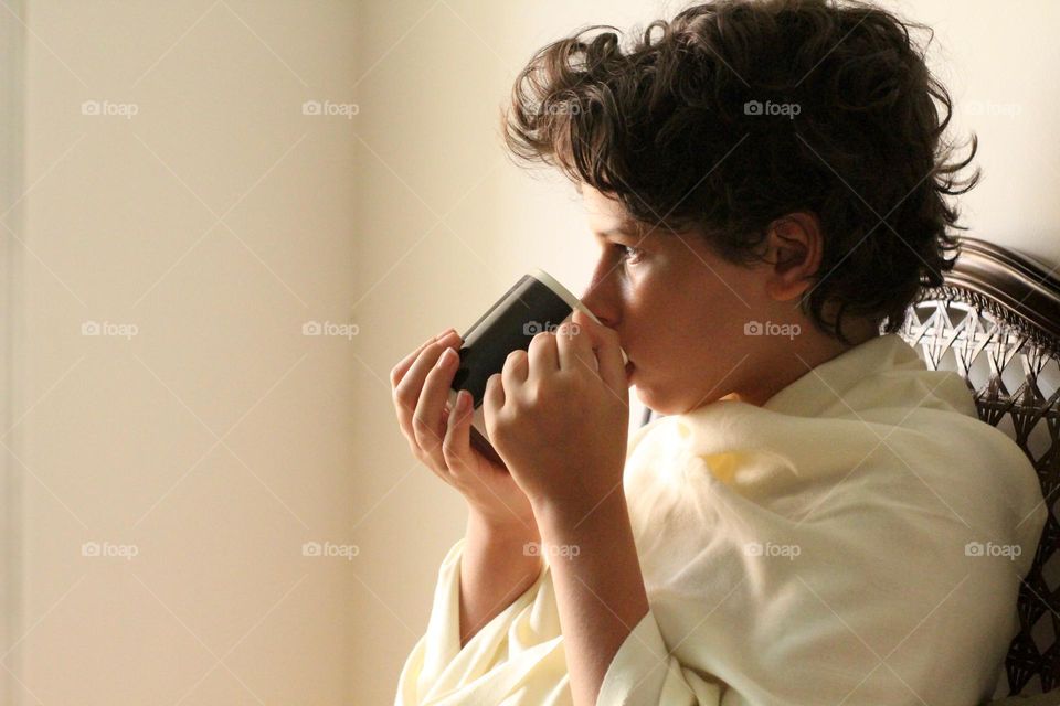 Girl drinking tea from a mug