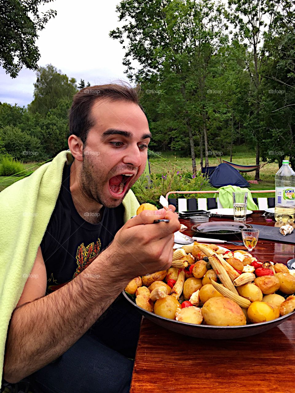 Man eating fresh food outdoors