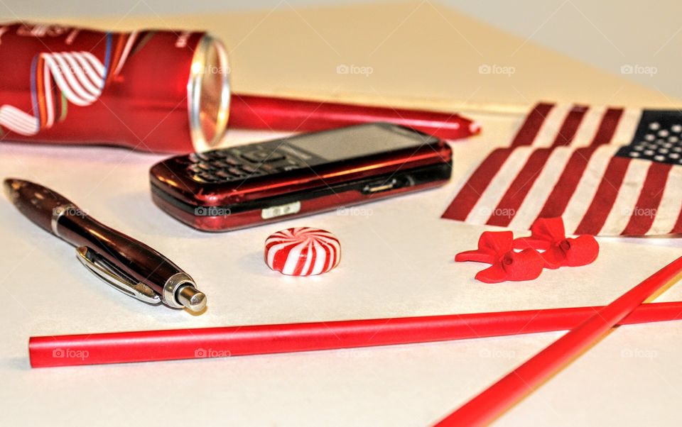 Things that are red, a red Coke can I bought when I was at the Grand Canyon, red candlestick, red striped American flag, a red ink pen my sister gave me, a red cell phone I found at work, Red Chopsticks A friend gave me, green striped peppermint candy, a red candlered bow ties