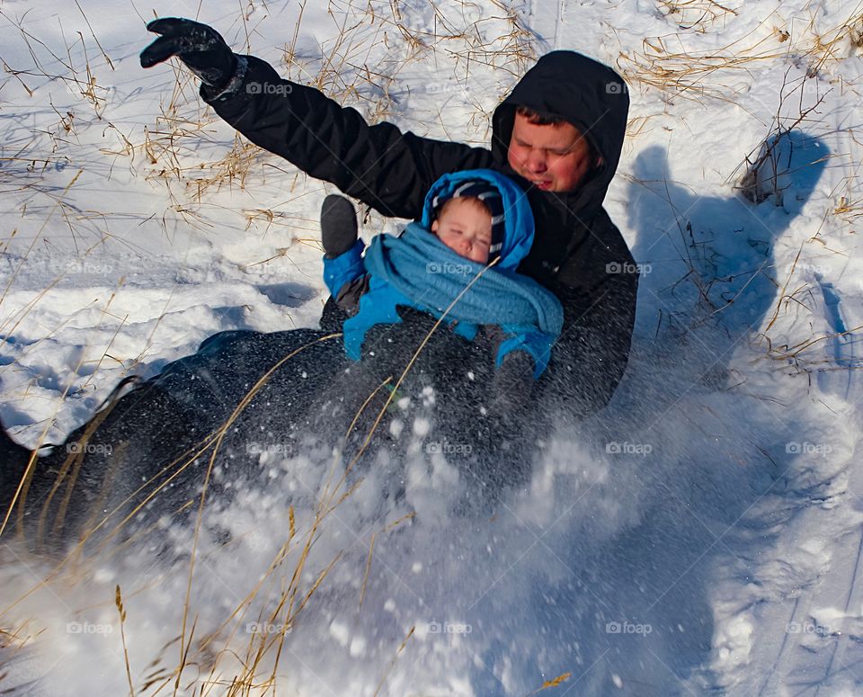 Powder flying in your face while tobogganing 