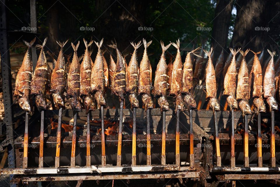 Street food. Grilled mackerel fish