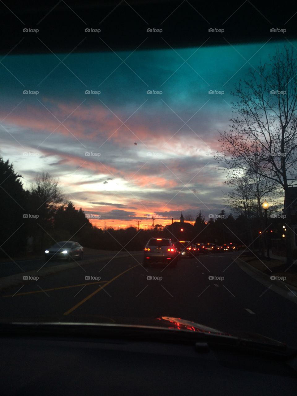 Blue, orange, grey-purple, light blue. What color is not in the sky rn? When you’re stuck in traffic and the sky is full of rich colors you may as well take a photo. 
