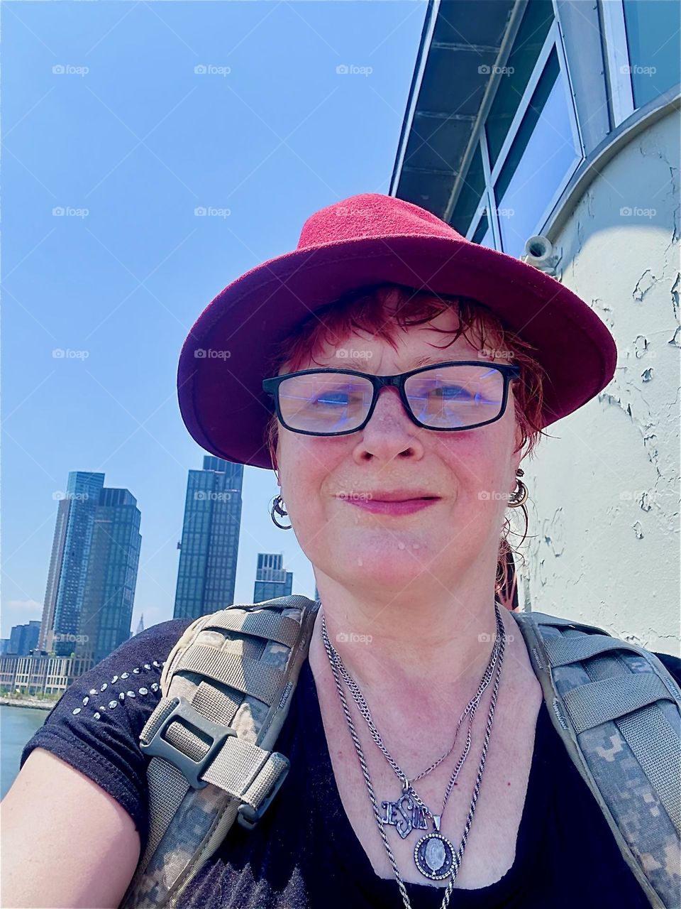 This is me, “Petra Schiller” a.k.a. “Maxine Firefox” by the center outpost of the “Pulaski Bridge” at “Newtown Creek” that connects LIC, Queens to “Greenpoint”, Brooklyn. 2024. Hypnotic Productions
