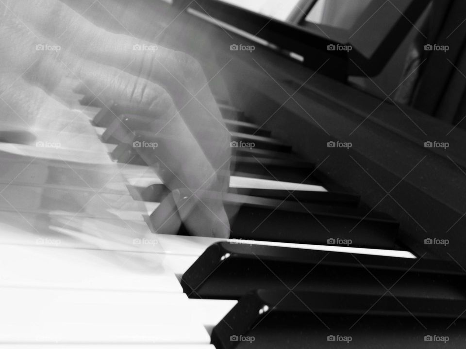 A Hand playing the piano