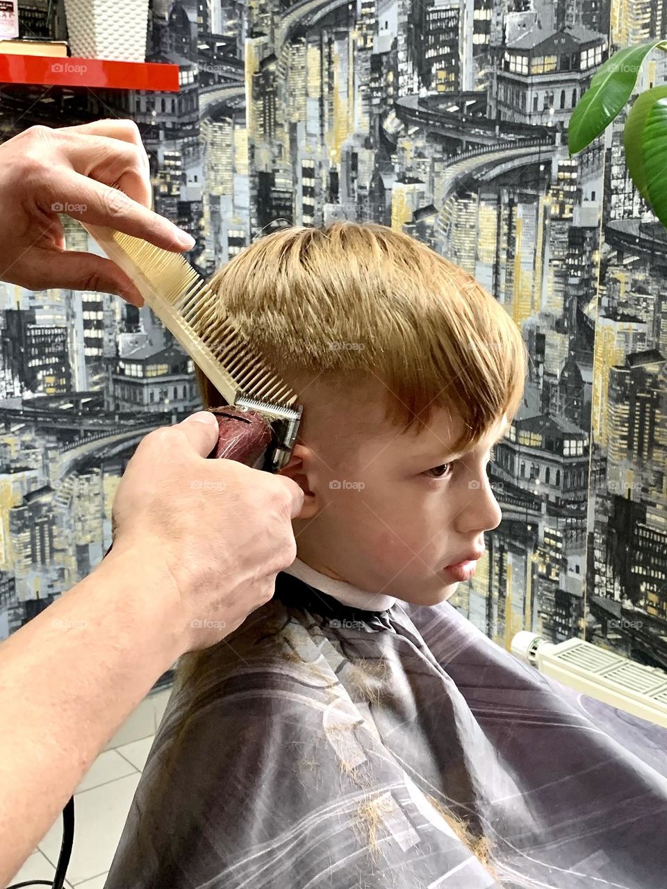 beauty salon hairdresser child boy getting a new haircut
