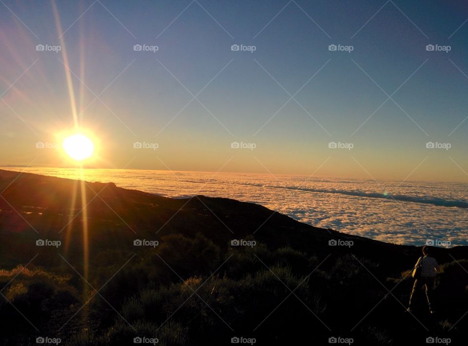 El Teide Golden Hour. El Teide Mountain on the left, Sun setting behing La Gomera and the Sea of Clouds on the right...Perfection on it's best