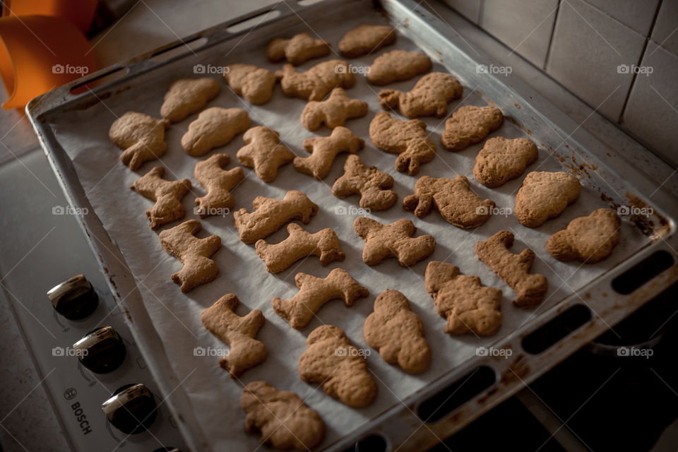 Little sisters cooking the biscuits 