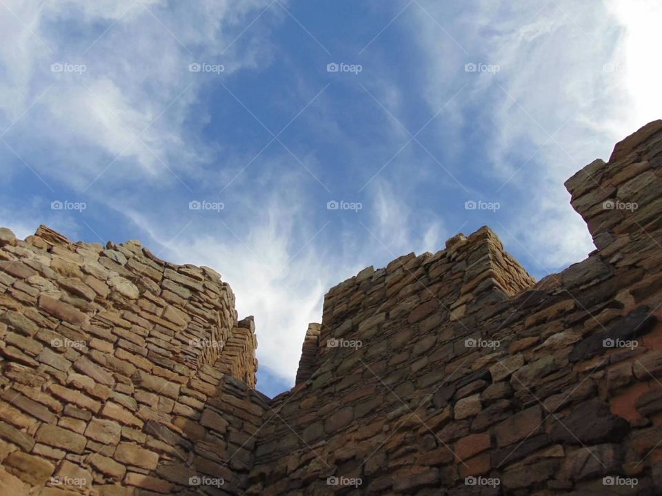 Stone wall meets blue sky. 