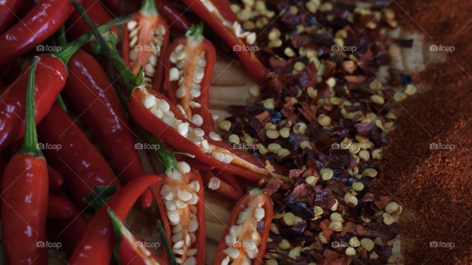 Whole chillies, half chillies, dried chili flakes, and dried chili powder. All the shapes of this red burning fruit. 