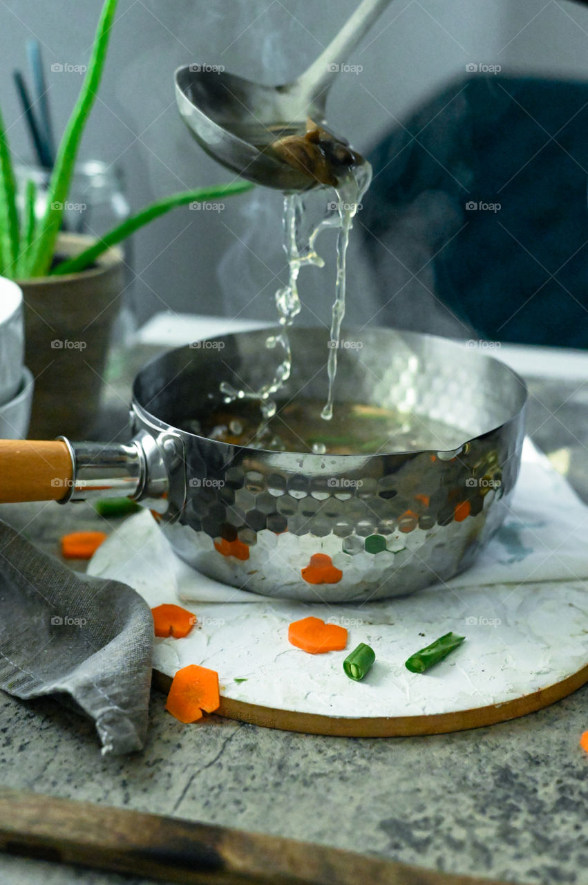 Soup mixing , mushroom soup , This is shout to autumn and call to winters , vegetable mushroom soup , steam, water , action shot 