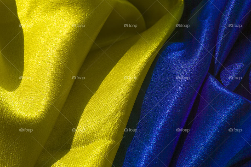 folds on the yellow and blue satin