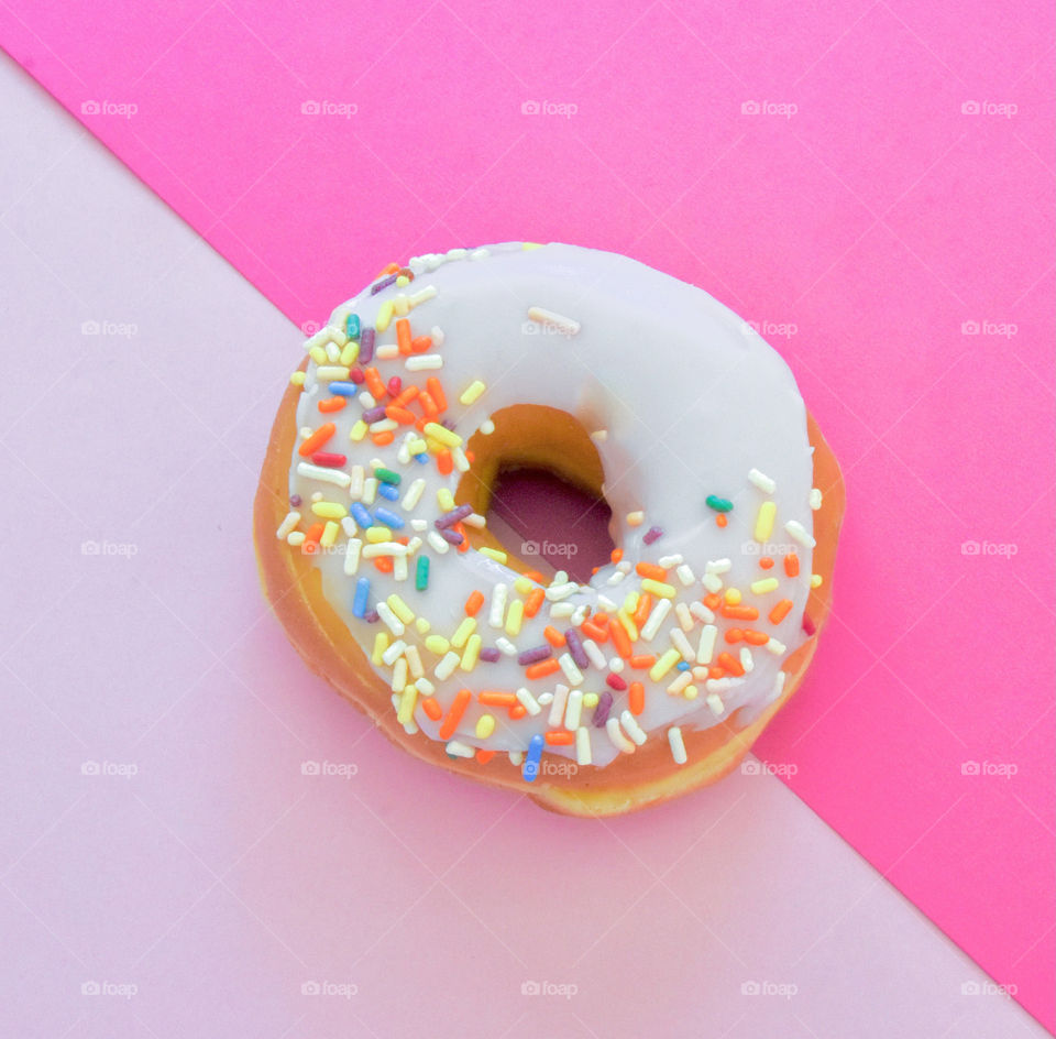 The color pink, donut on two shades of pink paper