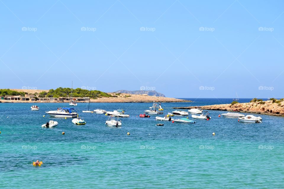 Ships in Port des Torrent beach in Ibiza