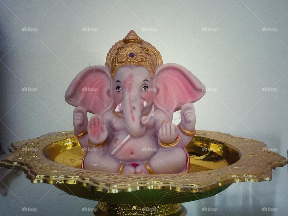 The photograph of the Lord Ganesha is placed on the pedestal.