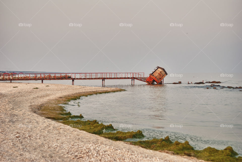 an old abandoned bridge going straight into the sea of Azov.