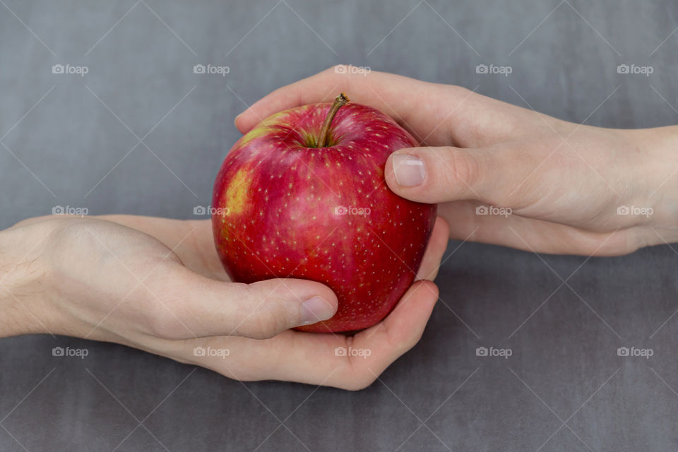 Close-up of an apple in hands