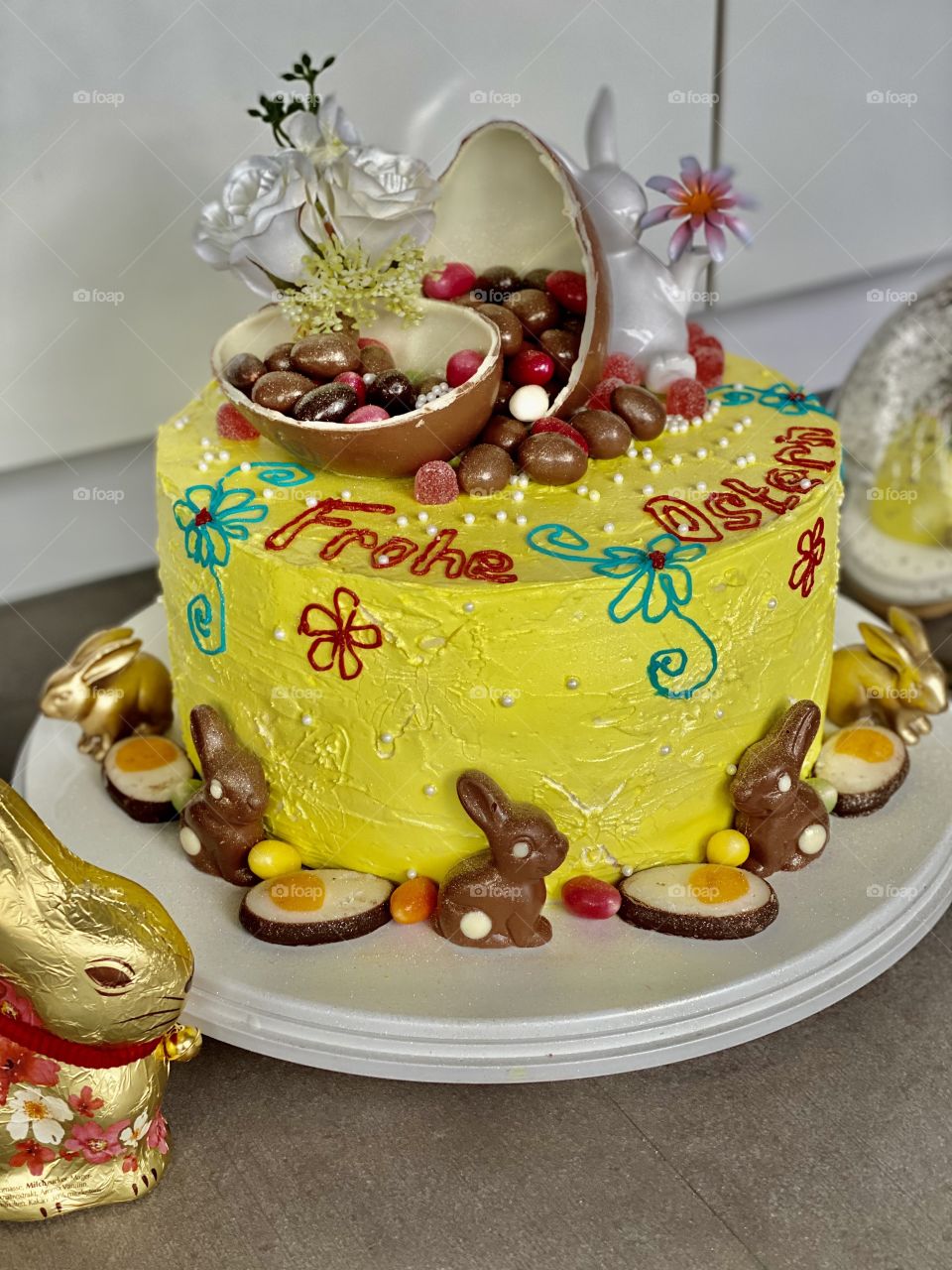 yellow Easter cake, birthday cake, bunny cake, chocolate bunnies, chocolate eggs, colored eggs, Easter eggs, colorful eggs, flowers on the cake, good Easter, raspberry cream cake