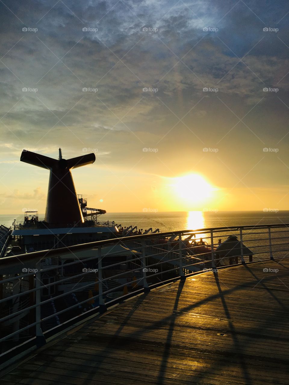 Sunrise over the top of Carnival’s Ecstasy  