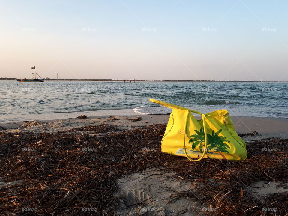 Green beach bag at the beach