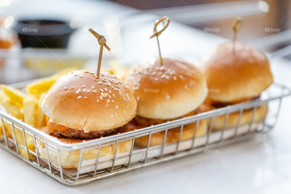Delicious three mini burgers as snack food