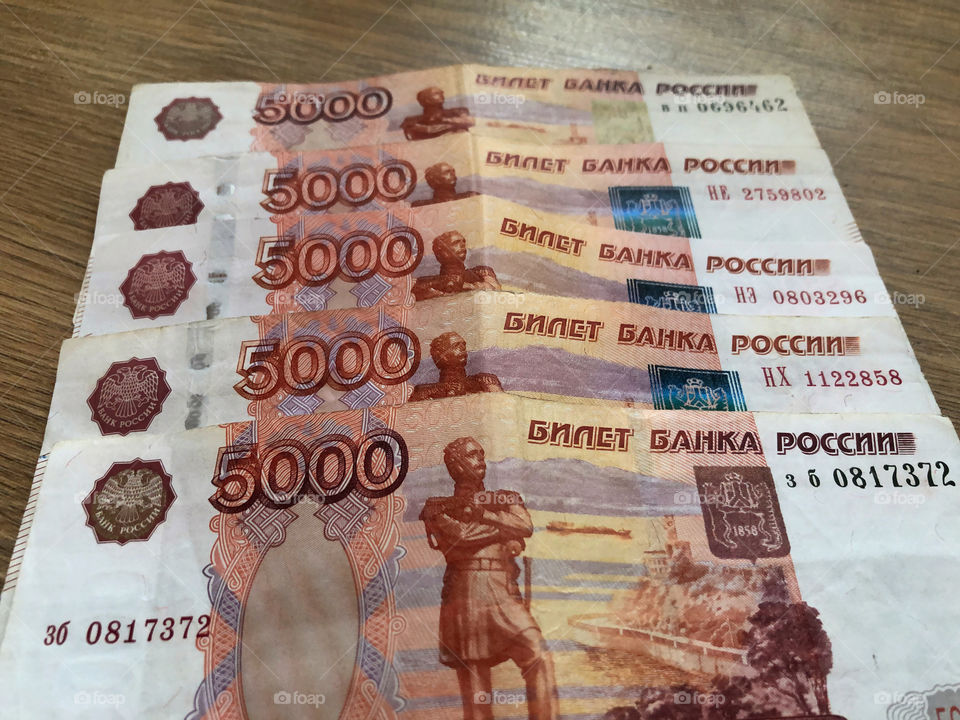 Russian banknotes on wooden background