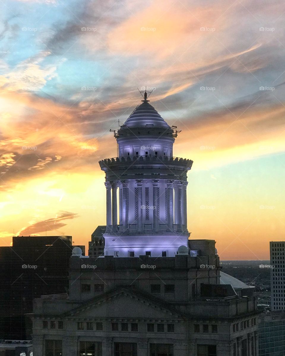 Hibernian Tower Apartment Building. Historic New Orleans. Beautiful sunset with glowing building. 