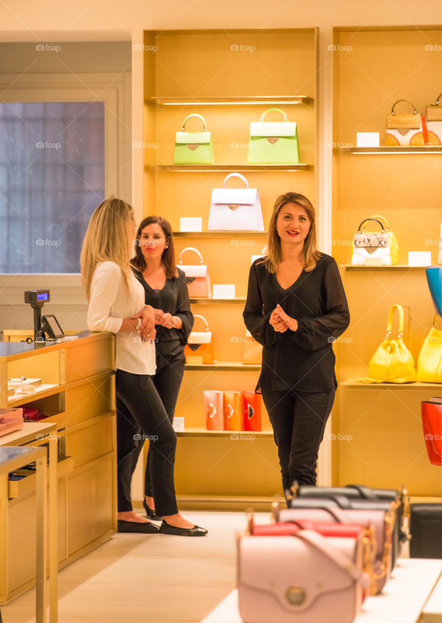 Female Employers Of A Ladies Handbags Retail Shop
