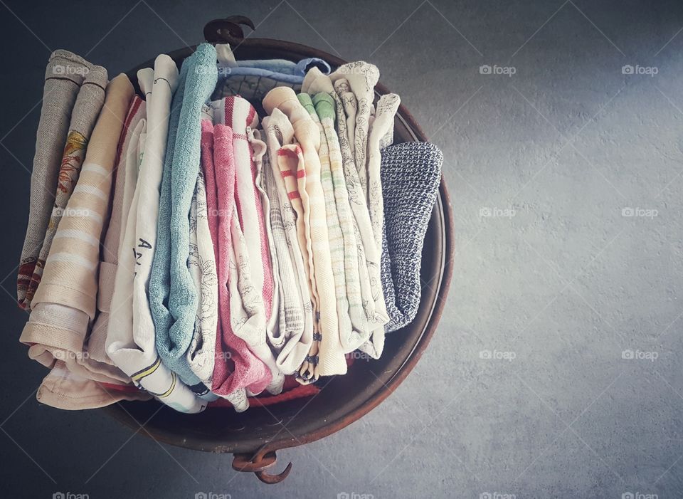 laundry kitchen cleaning rags in copper bucket