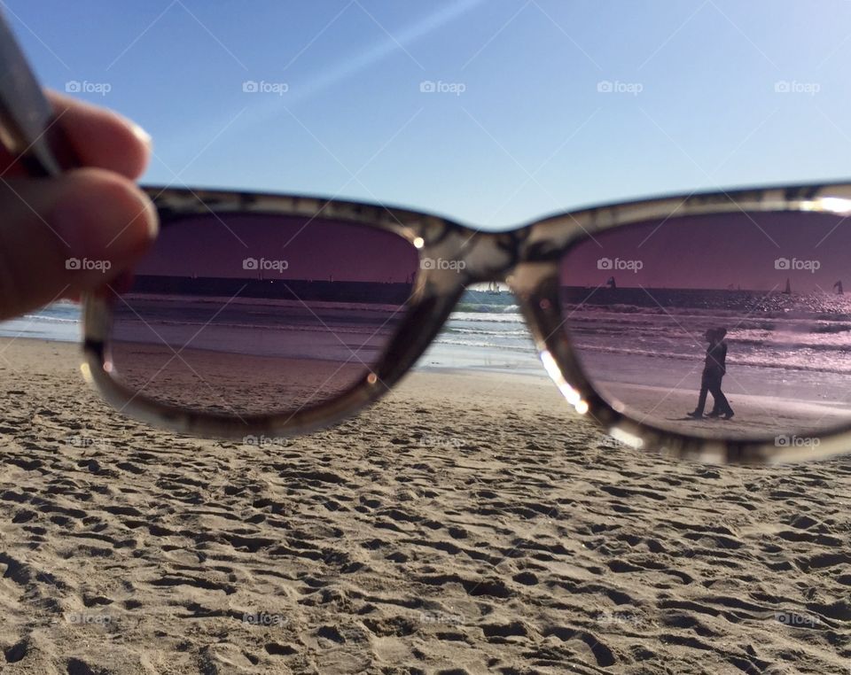 A couple in silhouette Through My sunglasses 