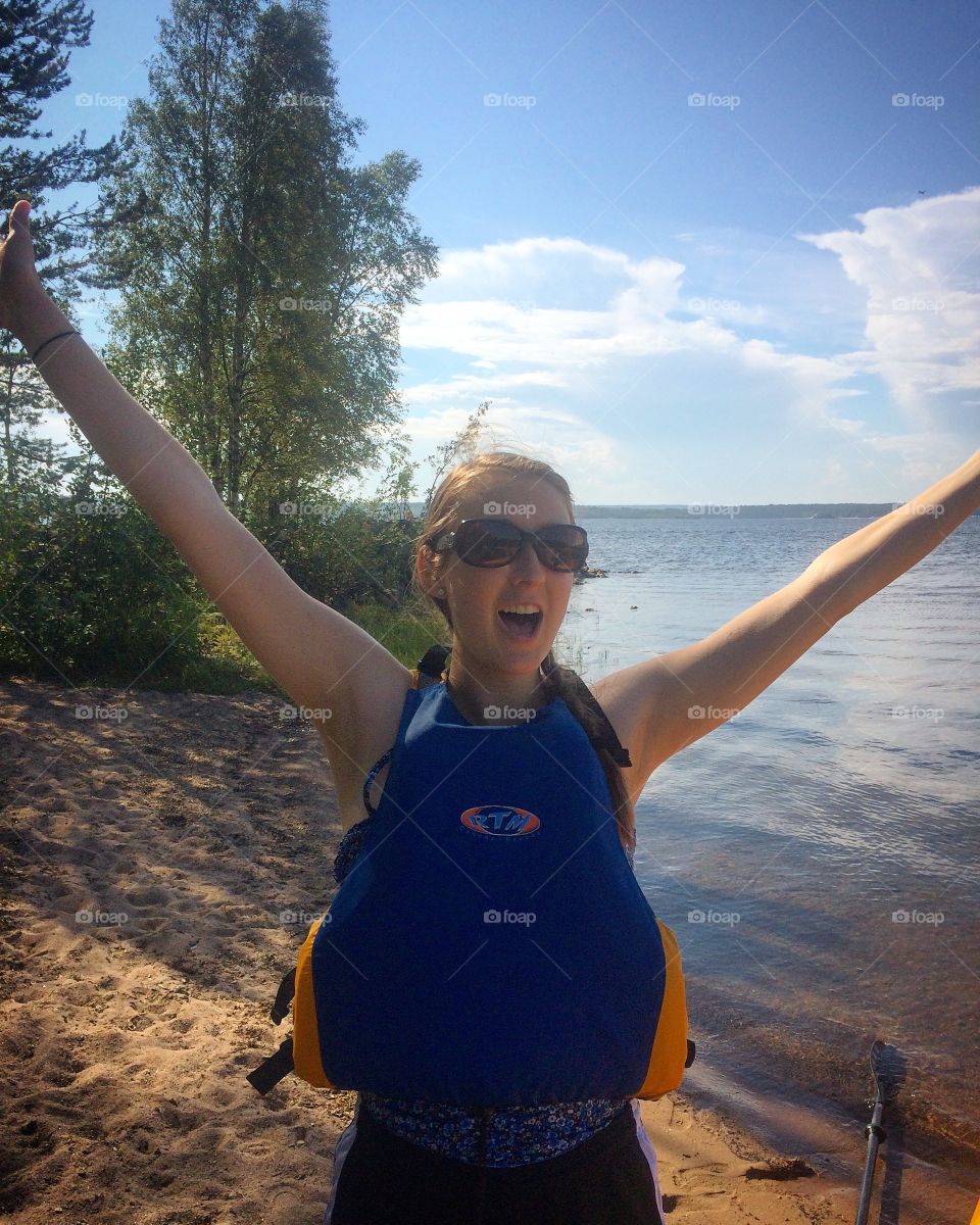 Kayaker hä
Happy girl 
 arms up 
Sunglasses 