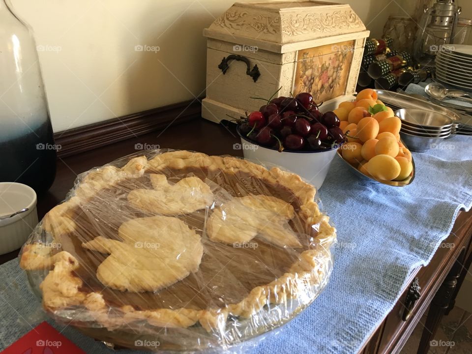 Homemade scratch pumpkin pie on sideboard in dining room