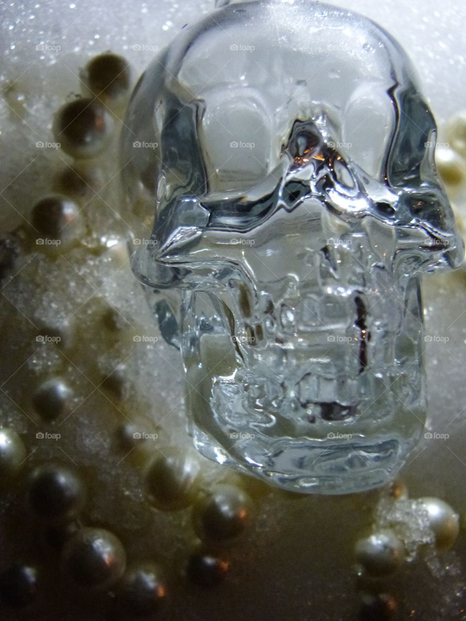 crystal skull in snow and pearls