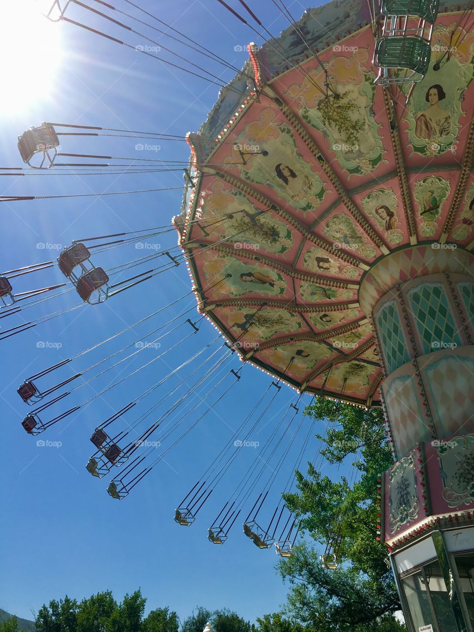 Perfect skylight. Sun burst. Swing. Chair swing. Amusement ride. Decorated ride.