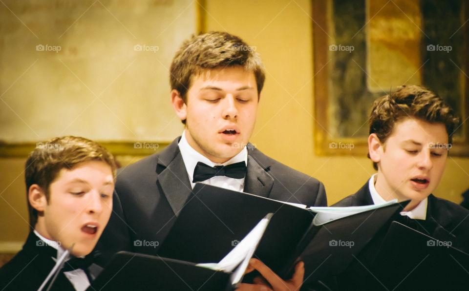 Choir Singers Boys With Formal Dress Reading Music Scores
