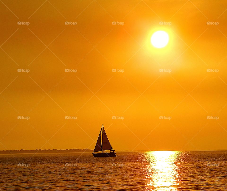 I love this photo - Sailing in the sunset - my photos have the ability to communicate with the viewer by telling a story through their composition, lighting, and most importantly their subject matter