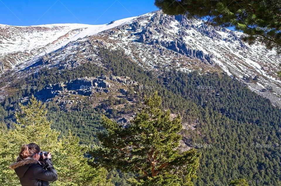 Young girl shooting a photo 