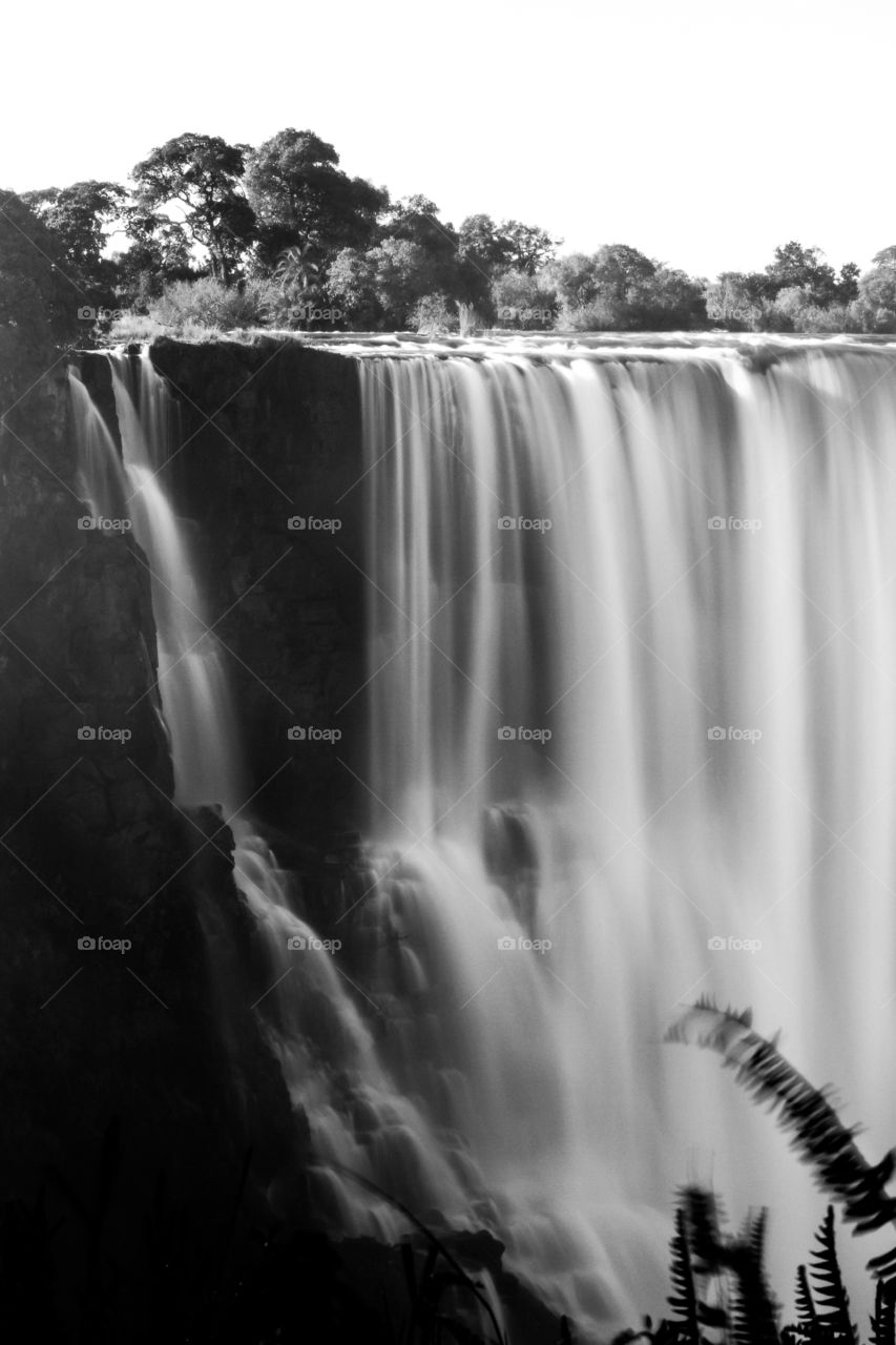 Long exposure image of the mighty Zambezi river forming the Vic falls in Africa