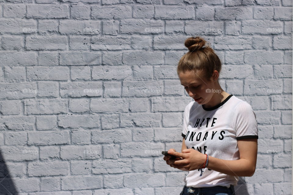 Young woman using cellphone