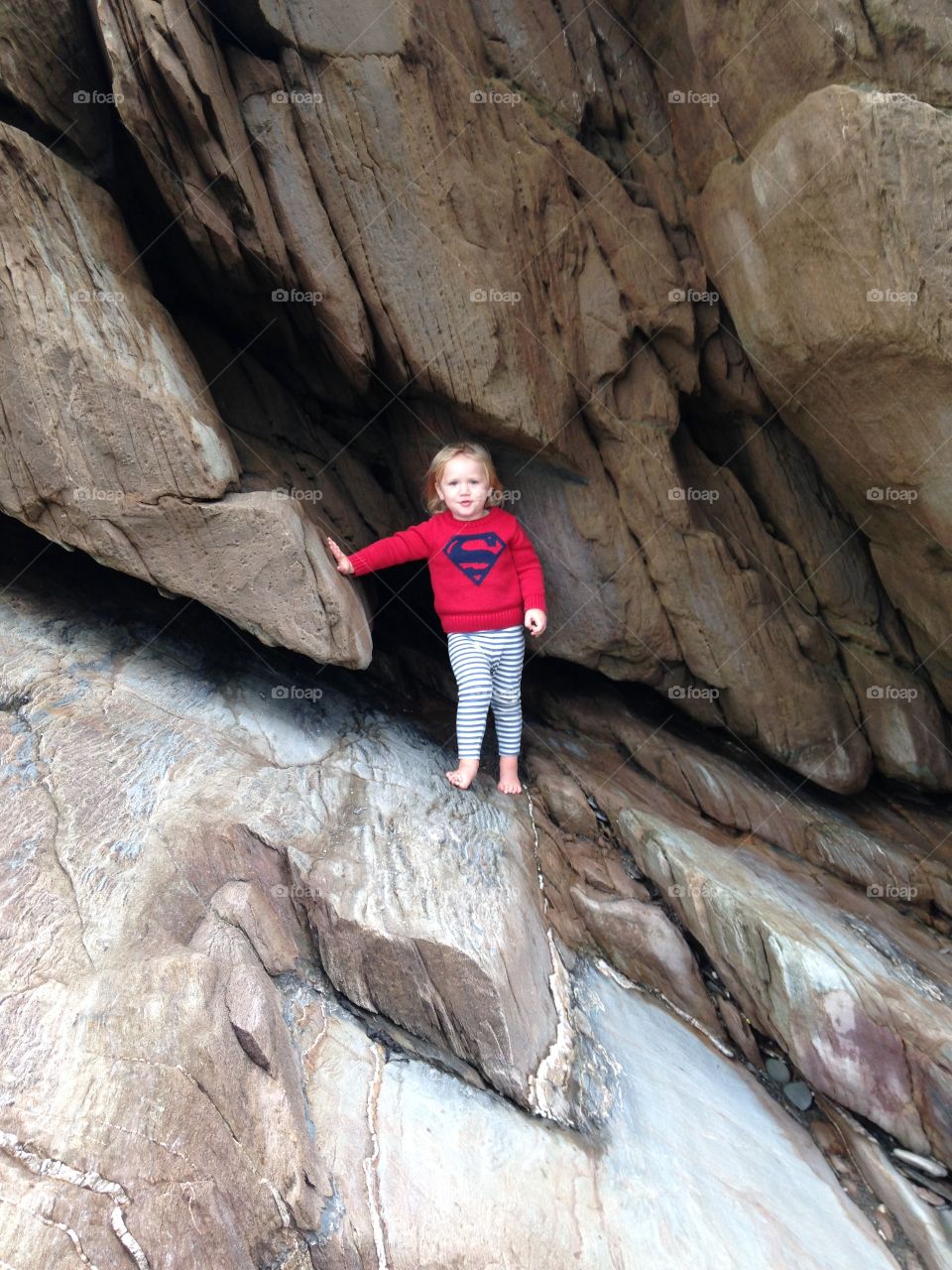 Super boy on the rocks of Ilfracombe 