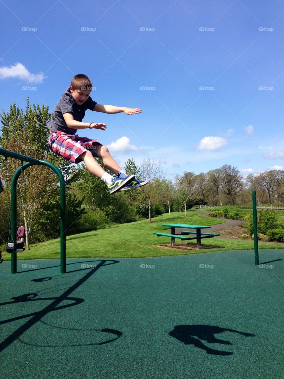 Swing Jump. Boy jumping from swing
