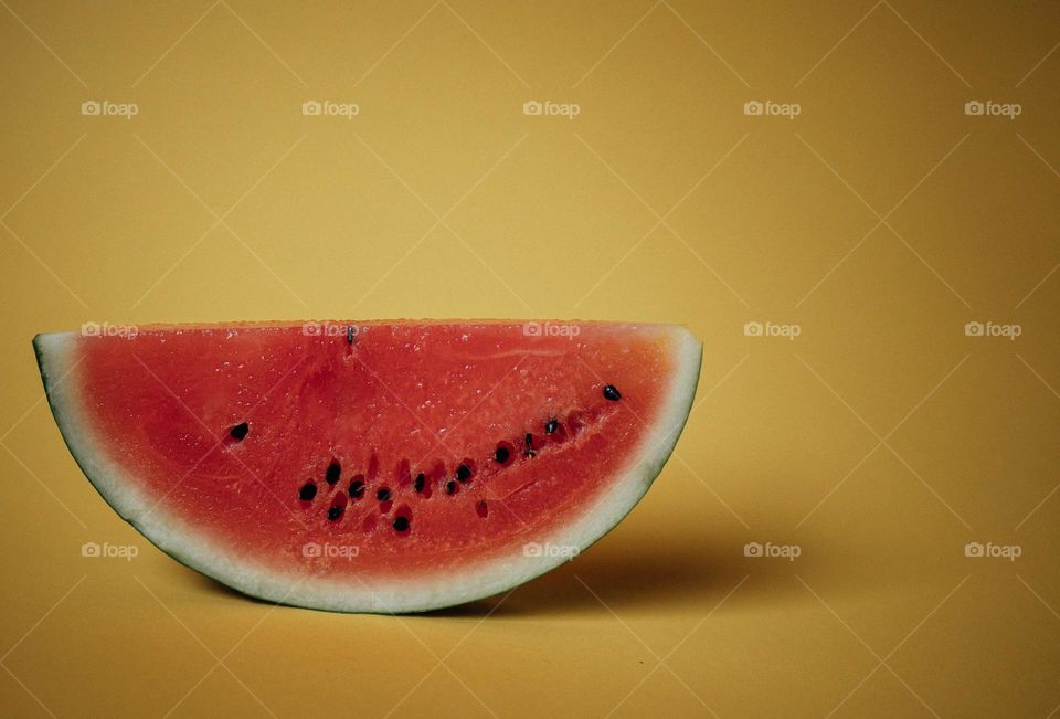 Sliced Watermelon on Yellow Background