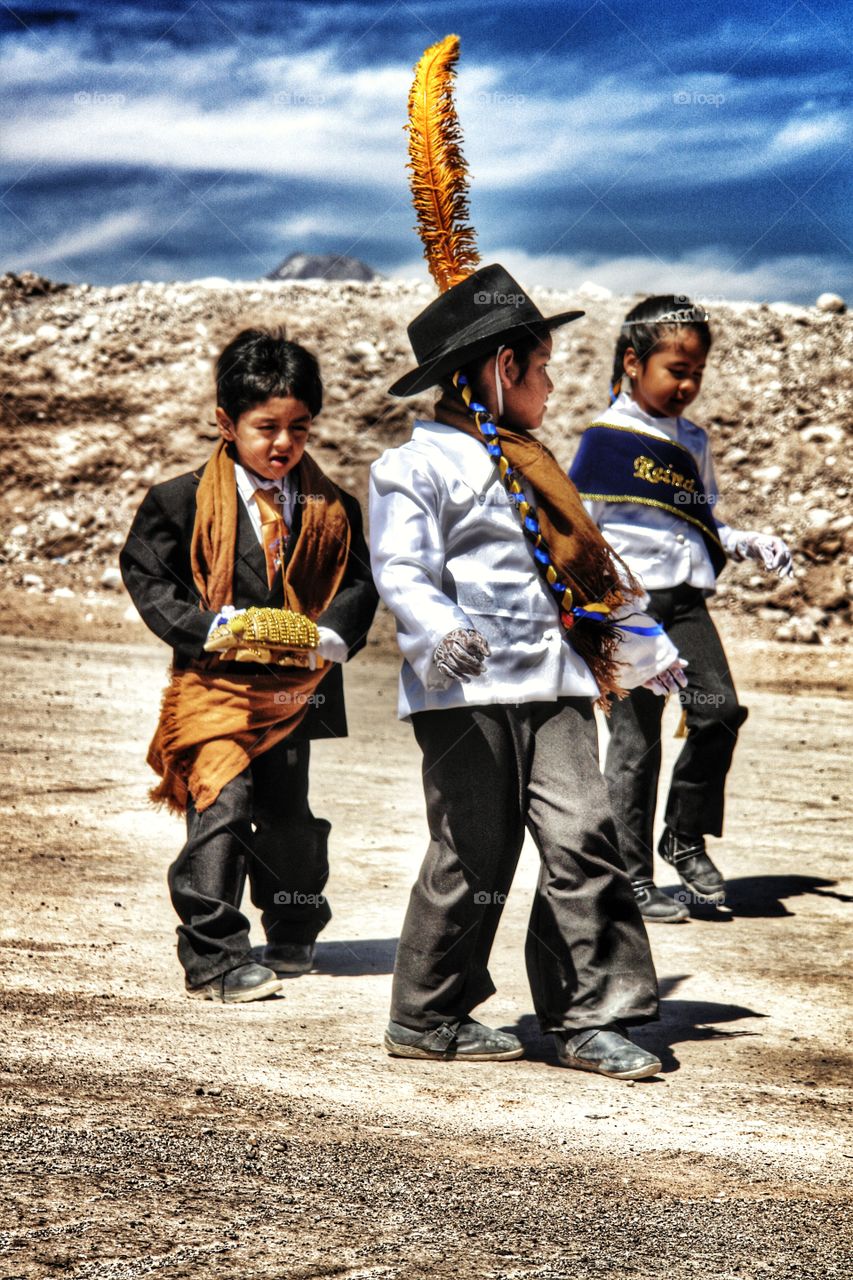 Children dancing in the desert at annual village fiesta, Atacama Desert, Chile . Children dancing in the desert at annual village fiesta, Atacama Desert, Chile