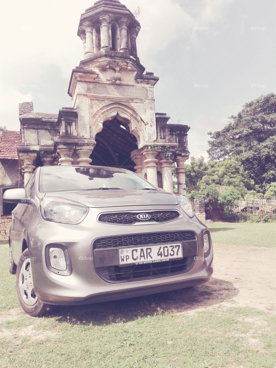 This is a picture of car and old palace in Jaffna in Sri Lanka.