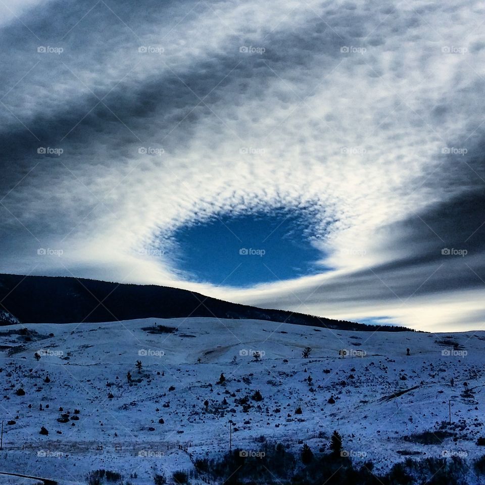 A Hole To Heaven . Odd cloud parting near Helena MT